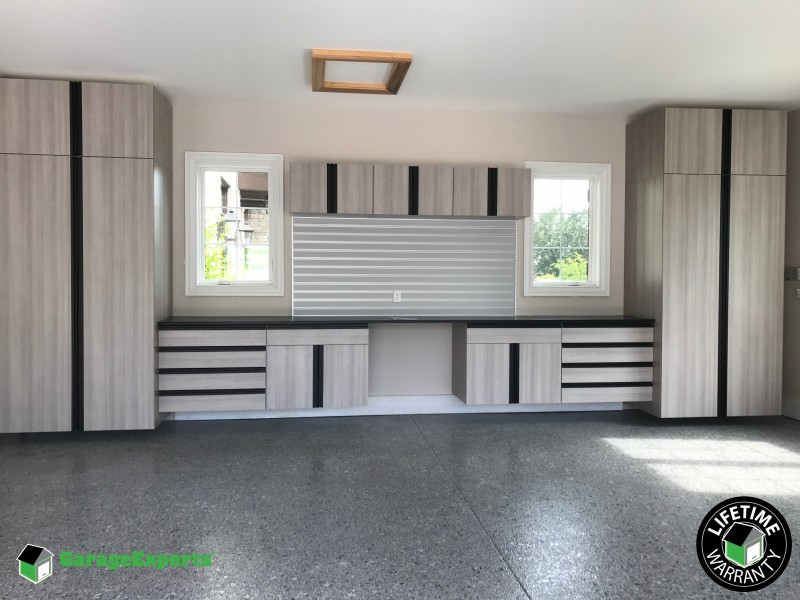 Residential Garage Epoxy Flooring And Cabinet Storage Solution In