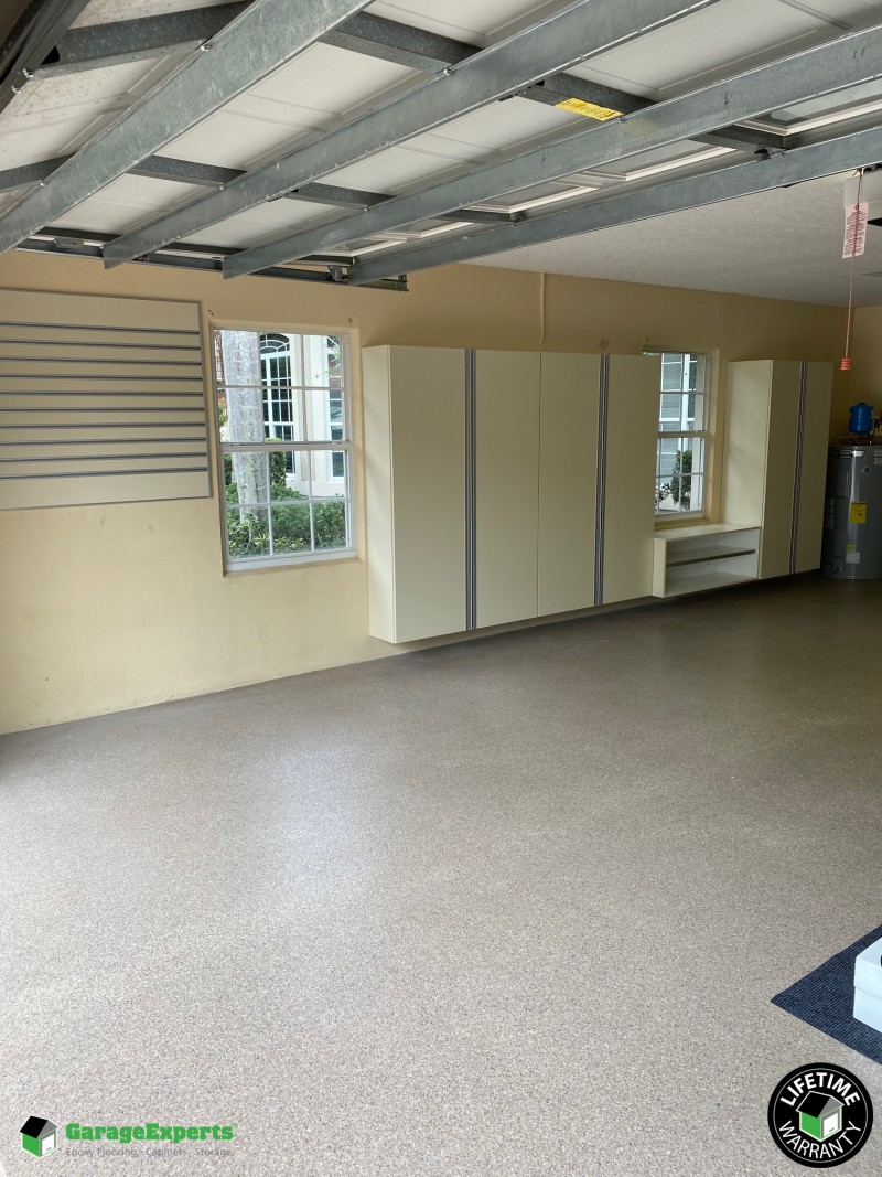 Residential Garage Epoxy Flooring And Cabinet Storage Solution In
