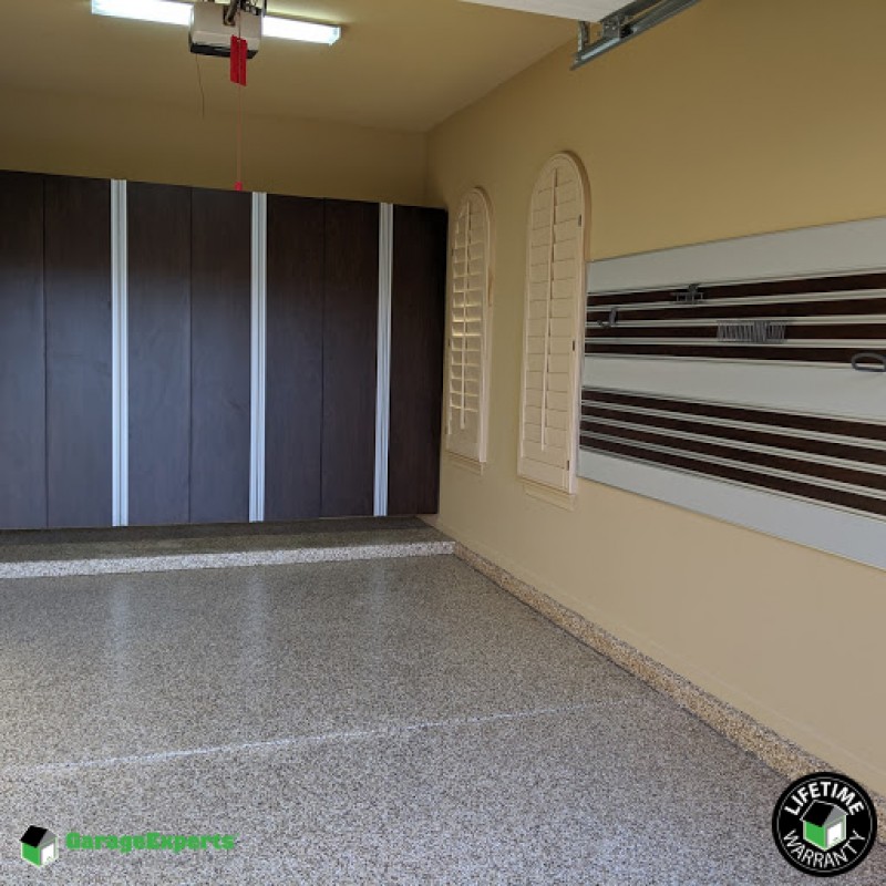 Residential Garage Epoxy Flooring And Cabinet Storage Solution In