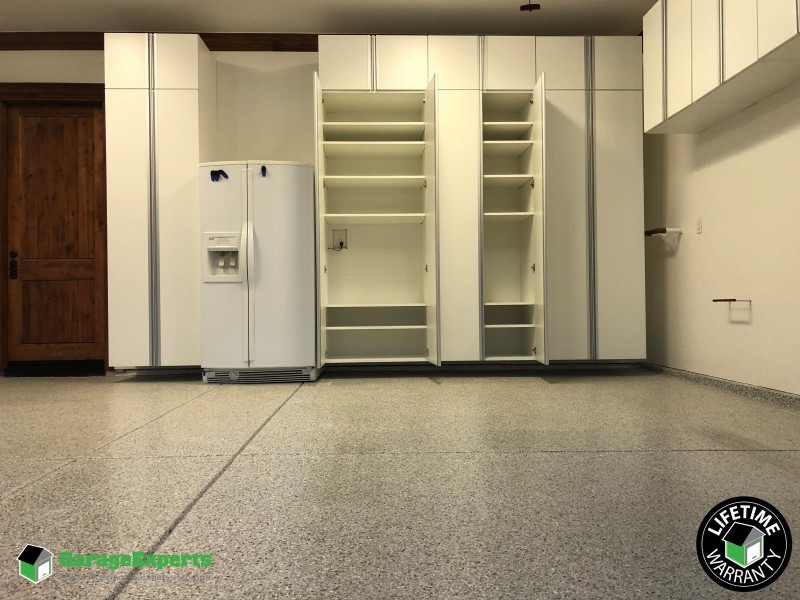 Residential Garage Epoxy Flooring And Cabinet Storage Solution In