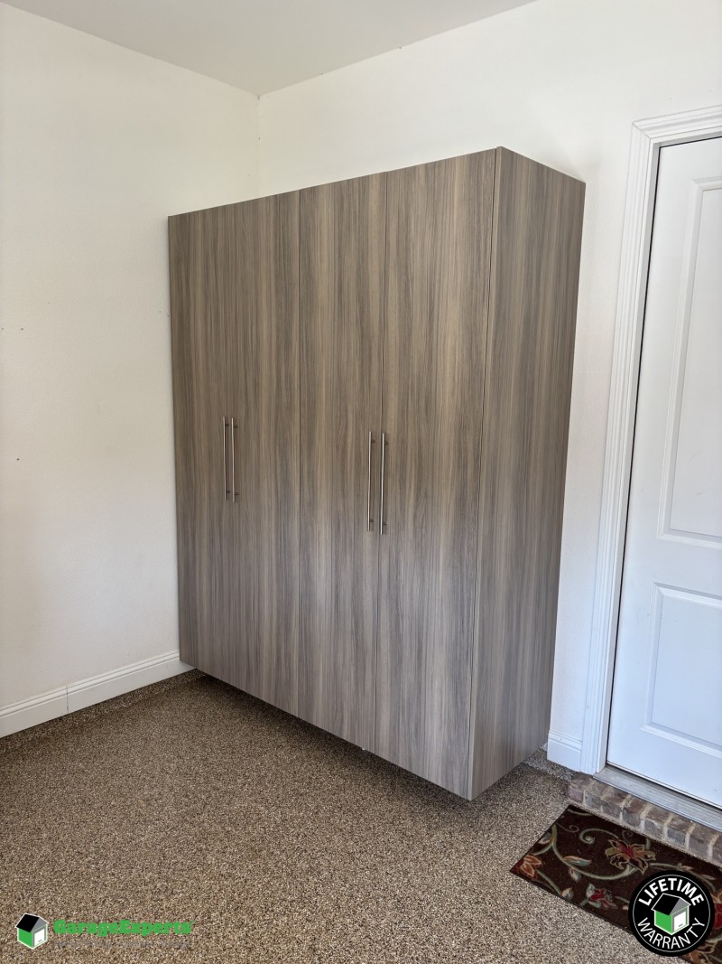 Residential Garage Epoxy Flooring and Cabinet Storage Solution in Lantana, Tx