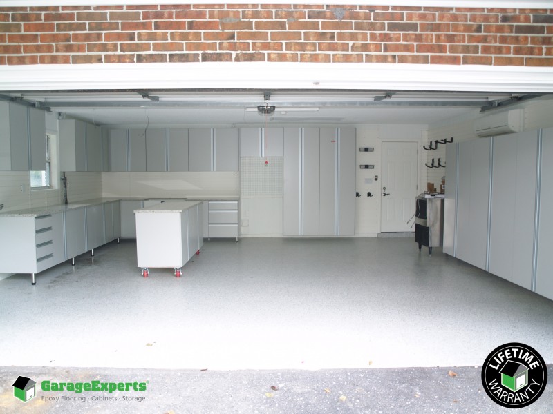 Residential Garage Epoxy Flooring and Cabinet Storage Solution in Lakeland, Fl