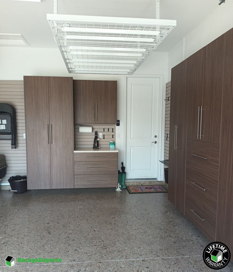 Residential Garage Epoxy Flooring and Cabinet Storage Solution in Boca Raton, Fl