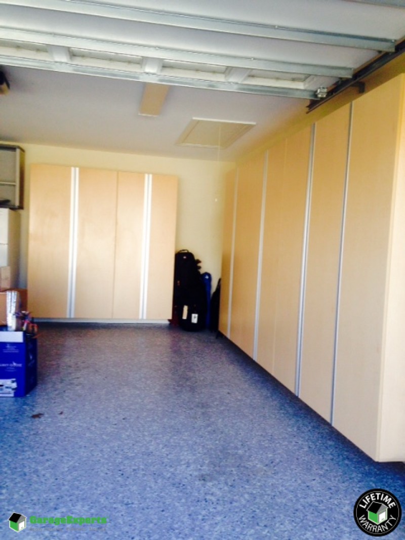 Residential Garage Epoxy Flooring and Cabinet Storage Solution in Indlan Land, Sc