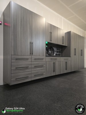 Residential Garage Epoxy Flooring and Cabinet Storage Solution in Eagle River, Ak