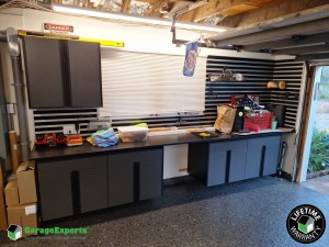 Residential Garage Epoxy Flooring and Cabinet Storage Solution in Northport, Ny