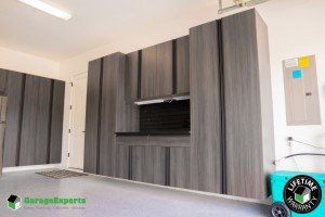 Residential Garage Epoxy Flooring and Cabinet Storage Solution in Eden Prarie, Mn