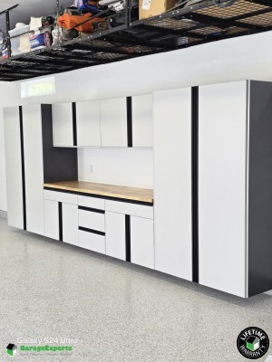 Residential Garage Epoxy Flooring and Cabinet Storage Solution in Wasilla, Ak