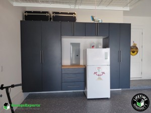 Residential Garage Epoxy Flooring and Cabinet Storage Solution in Watersound Origins At Inlet Beach, Florida