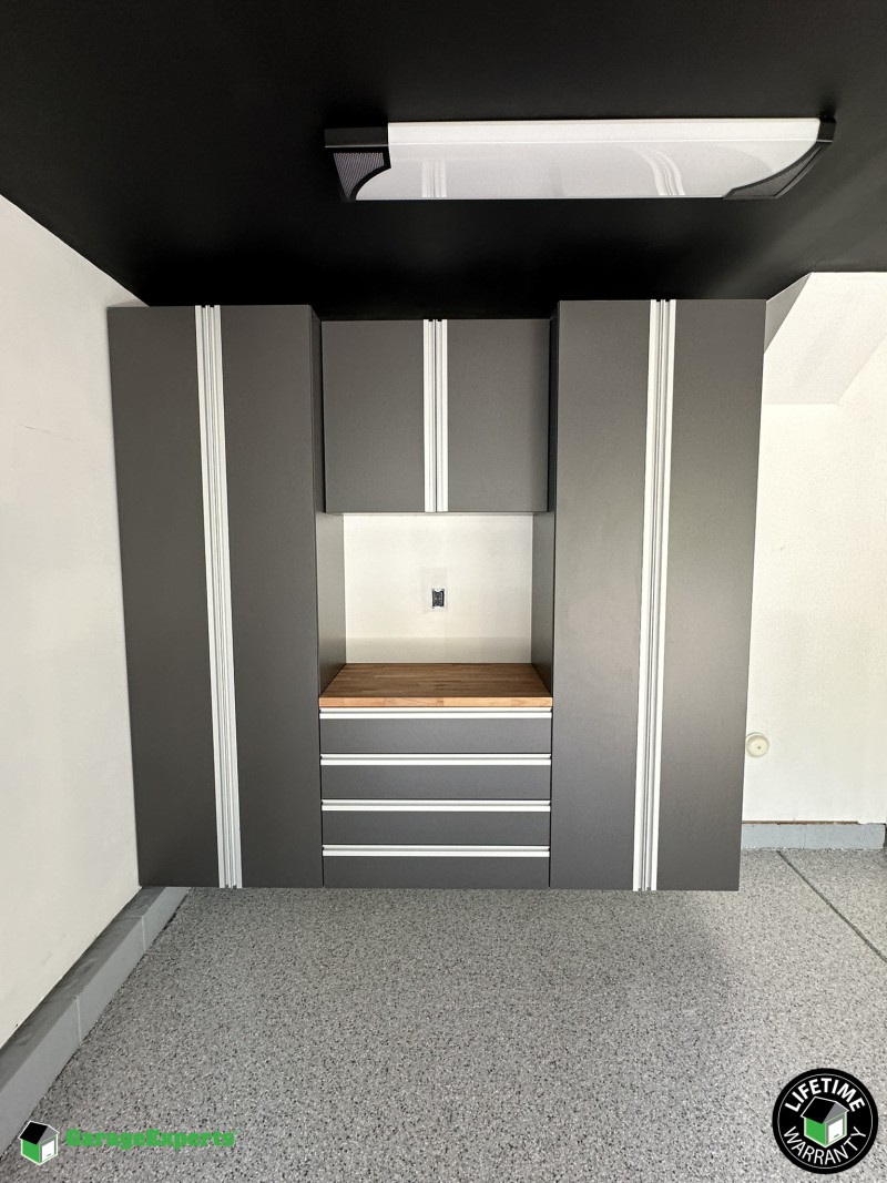 Residential Garage Epoxy Flooring and Cabinet Storage Solution in Fuquay Varina, Nc