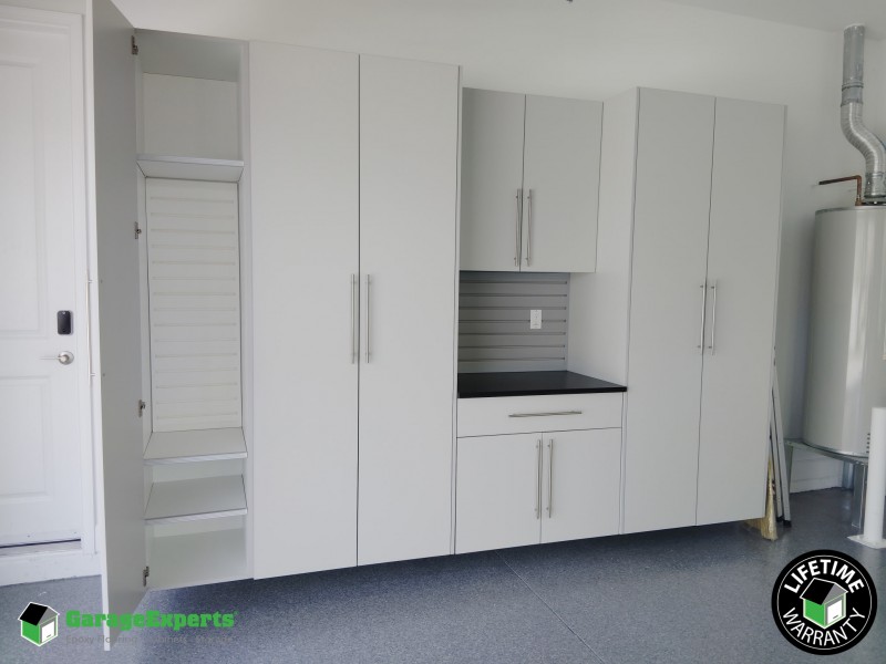 Residential Garage Epoxy Flooring and Cabinet Storage Solution in Boynton Beach, Fl
