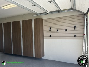 Residential Garage Epoxy Flooring and Cabinet Storage Solution in Polk City, Fl