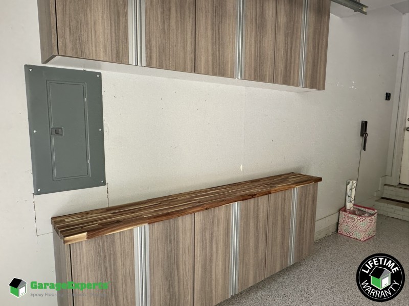 Residential Garage Epoxy Flooring and Cabinet Storage Solution in Wake Forest, Nc Image