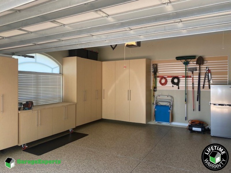 Residential Garage Epoxy Flooring and Cabinet Storage Solution in Lakeland, Fl