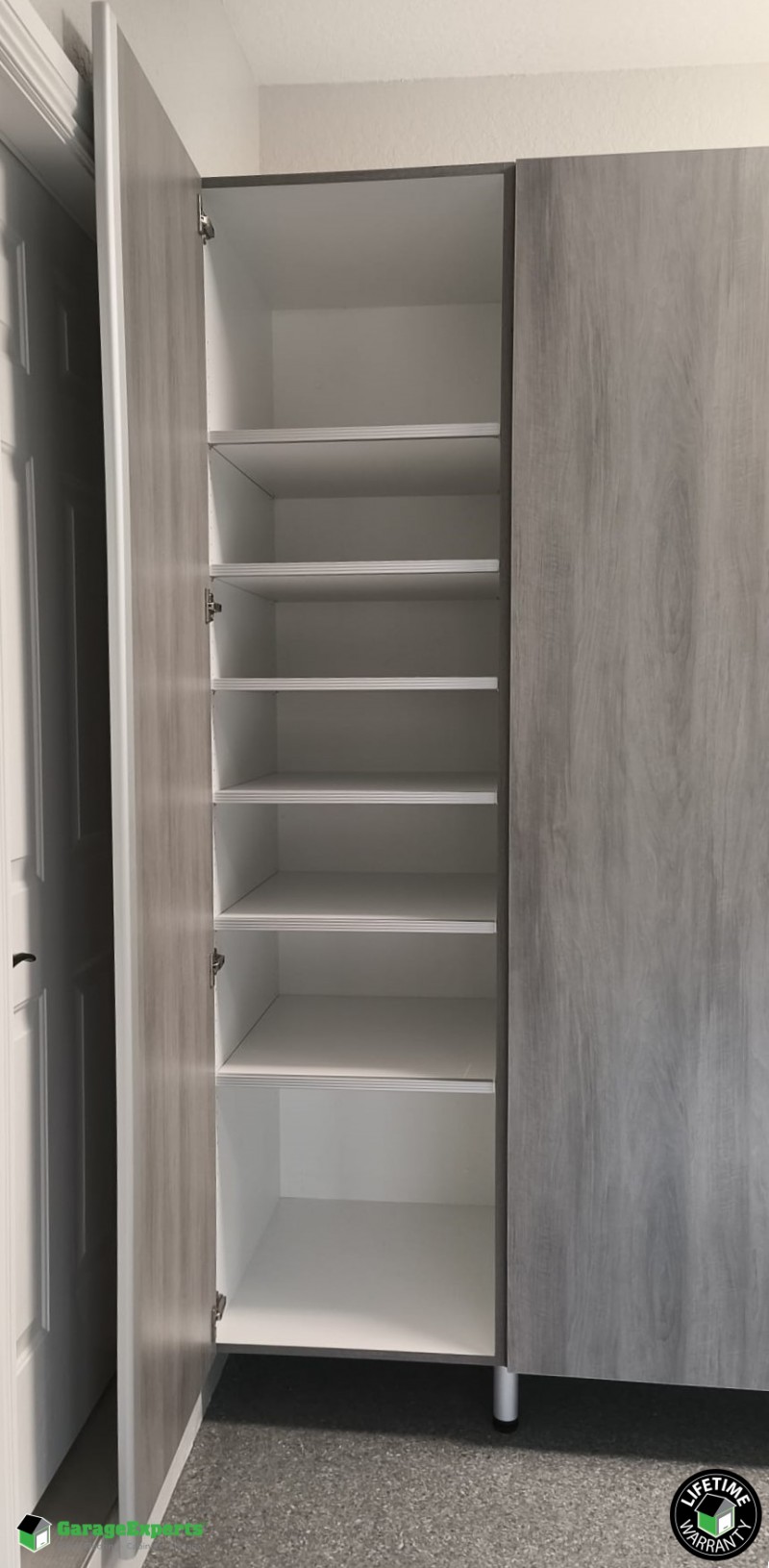 Residential Garage Epoxy Flooring and Cabinet Storage Solution in Plantation, Fl Image