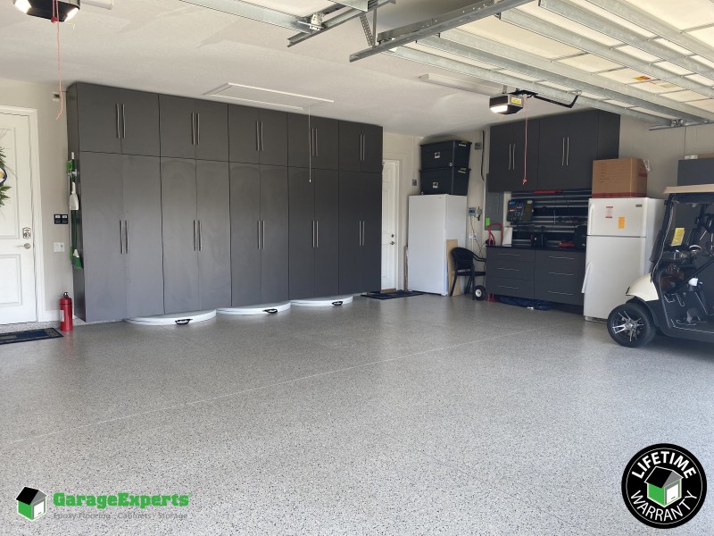 Residential Garage Epoxy Flooring and Cabinet Storage Solution in Lakeland, Fl