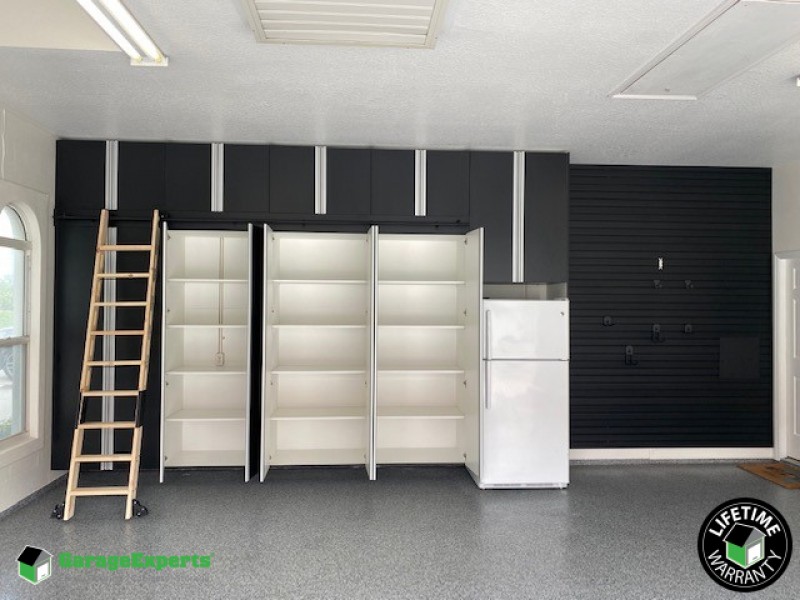 Residential Garage Epoxy Flooring and Cabinet Storage Solution in Winter Haven, Fl