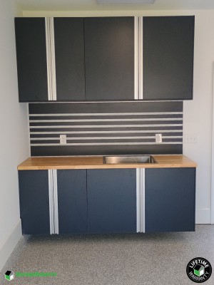 Residential Garage Epoxy Flooring and Cabinet Storage Solution in Evans, Georgia