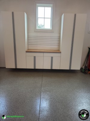 Residential Garage Epoxy Flooring and Cabinet Storage Solution in Barrington, Ri