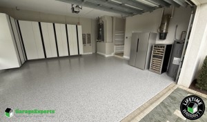 Residential Garage Makeover With Paint Epoxy Flooring and Cabinet Storage Solution in Palm City, Fl