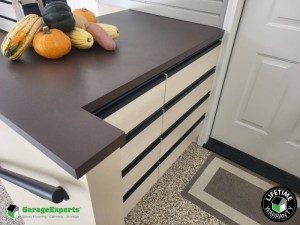 Residential Garage Epoxy Flooring and Cabinet Storage Solution in Fort Collins, Co