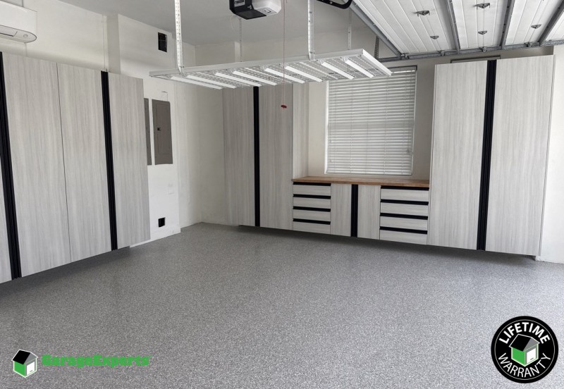 Residential Complete Garage Makeover With Epoxy Flooring and Cabinet Storage Solution in Jupiter, Fl