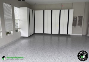 Residential Garage Makeover With Paint Epoxy Flooring and Cabinet Storage Solution in Palm City, Fl