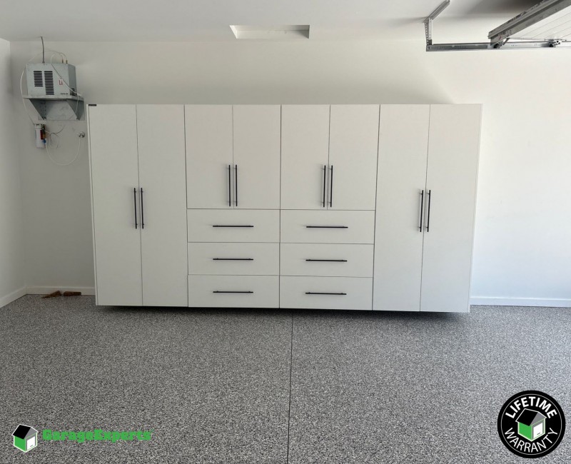 Residential Garage Epoxy Flooring and Cabinet Storage Solution in Springfield, Mo