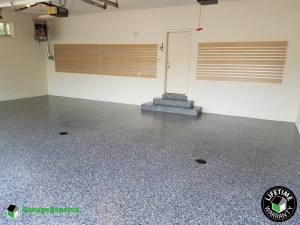 Residential Garage Epoxy Flooring and Cabinet Storage Solution in Hopkins, Mn