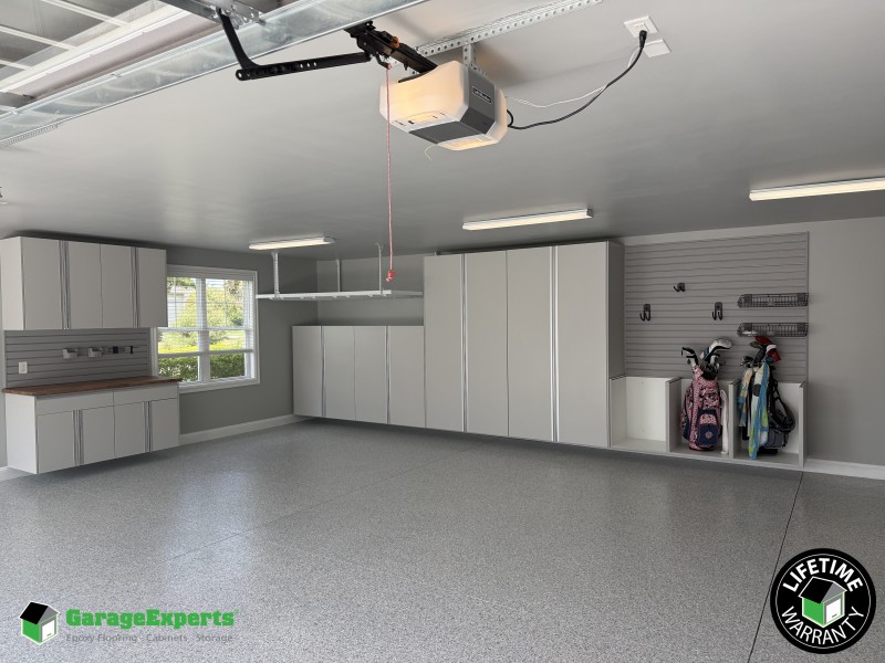Residential Garage Epoxy Flooring and Cabinet Storage Solution in Leland, Nc