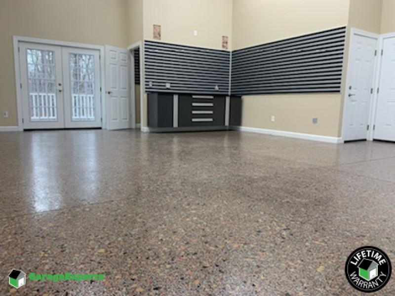 Residential Garage Epoxy Flooring and Cabinet Storage Solution in Summerfield, Nc